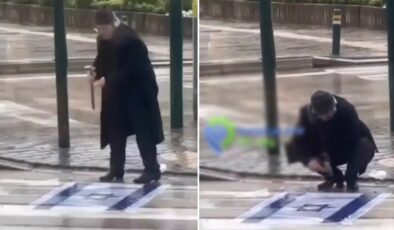 Bursa’nın Gürsu ilçesinde bir şahıs, gelen geçen bassın diye İsrail bayrağını asfalta çiviledi